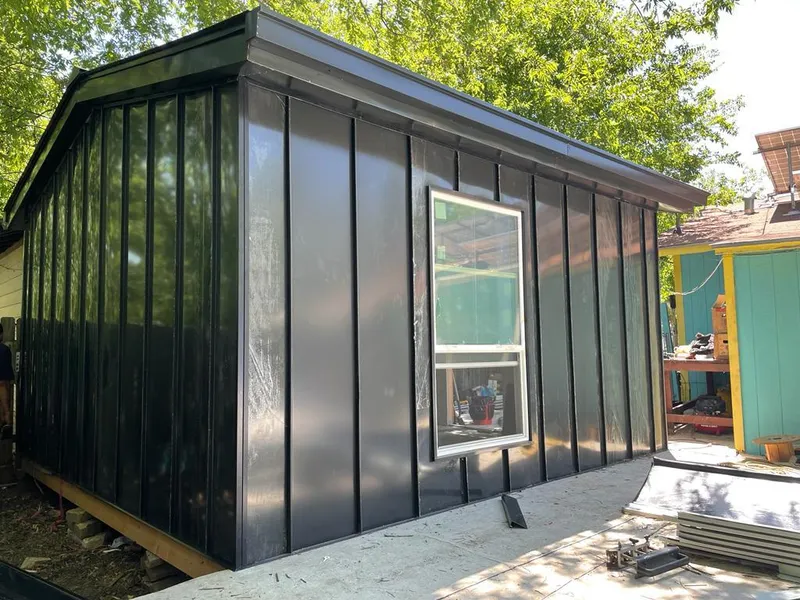 Black standing seam metal wall panels for Metal Roof Installation in Kenton